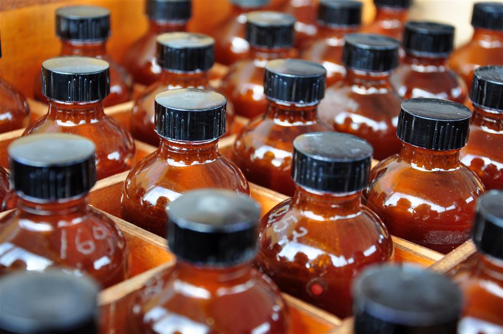 Amber bottles used to limit UV transmission through product packaging.